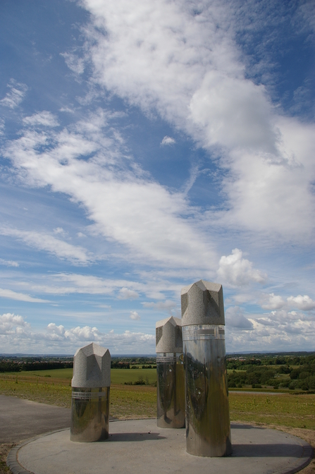 Large sculpture consisting of three cylinders stood in a triangle formation at Weetslade Country Park.