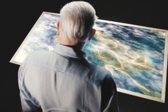 David Attenborough and map