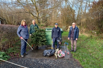 St Nicholas Park Volunteer Gardening Group sorting out the rubbish dumped on the site, image Rob Drummond.