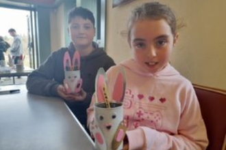 Ruby and Max from Newcastle with their Hauxley created bunny planters. Image by Julia Carr.