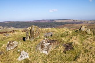 A cairn at Rothbury Estate. Cairns are often used as trail markers or memorials, and this one is set against a natural landscape