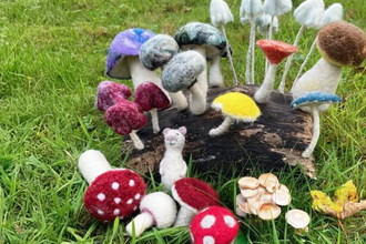 Felted mushrooms in a field