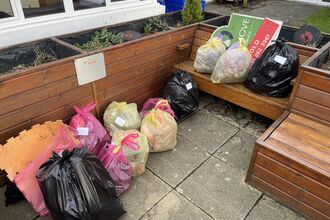 Bags of collected rubbish stacked up. Image by Rhiannon Studholme.