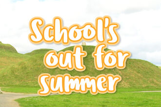 Banner reading ‘School’s out for summer’ over rolling green hills with a winding path under a cloudy sky.