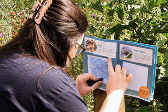 Natasha Hemsley trying her hand at the brass rubbing trail. Image by Natasha Hemsley.