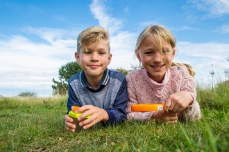 Children with magnifying glass - Matthew Roberts