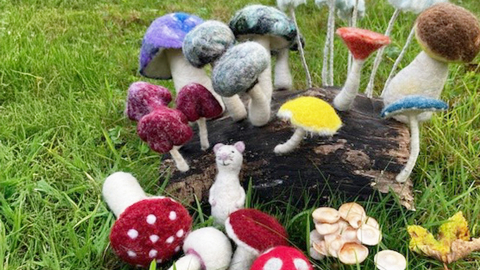 Felted mushrooms in a field