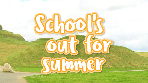 Banner reading ‘School’s out for summer’ over rolling green hills with a winding path under a cloudy sky.