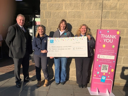 Sophie Webster, Catch My Drift Project Officer (second left) with members of the Co-op Amble team, image Co-op Amble