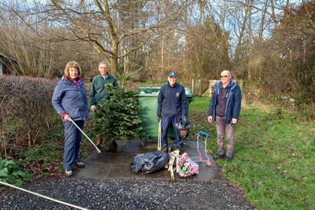 St Nicholas Park Volunteer Gardening Group sorting out the rubbish dumped on the site, image Rob Drummond.