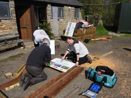 Lee Rankin, Wilding West Chevington project officer with Northumberland Wildlife Trust volunteers.  Image by Alex Lister.