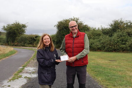 Frances Smiles handing Land Trust Award to Nigel Green. Image by Fiona Dryden.