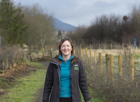 Deborah with a wheelbarrow on a nature reserve